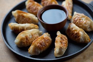 Gyoza dumplings in a frying pan, close-up, selective focus