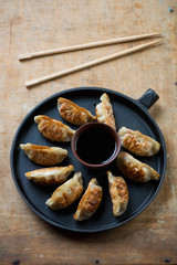 Frying pan with japanese traditional gyoza dumplings, above view