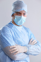 Male surgeon in mask looking at camera
