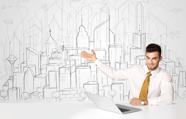 Businessman sitting at the white table with hand drawn buildings