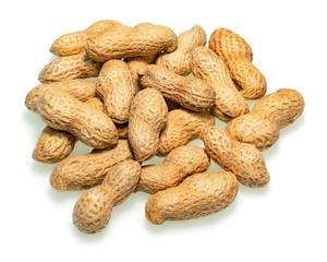 Pile of dry roasted peanuts isolated on white background.