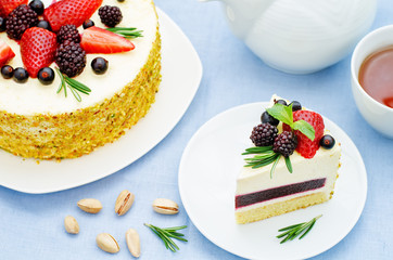 pistachio cake with berry compote and rosemary mousse