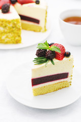 pistachio cake with berry compote and rosemary mousse
