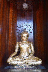 Buddha in wooden church