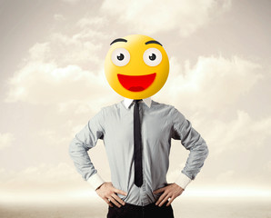businessman wears yellow smiley face