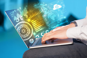 Modern notebook computer with future technology symbols