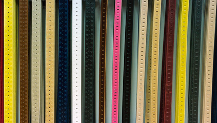 Colorful leather belts collection in the store.