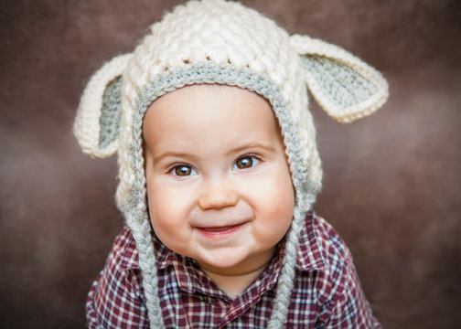 Adorable smiling kid in sheep hat