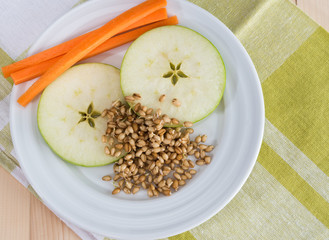 Apple, carrot and wheat sprouts