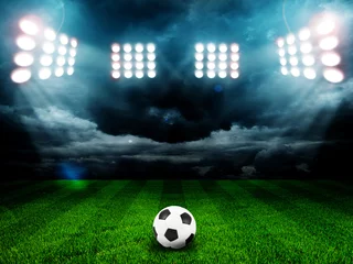 Schapenvacht deken met patroon Voetbal Soccer ball on the field of stadium with light