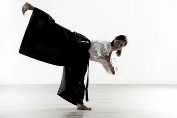 Afwasbaar Fotobehang Vechtsport beautiful woman wearing a hakama engaged in Jiu Jitsu 8