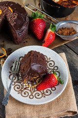 slice of homemade chocolate cake serving on retro plate