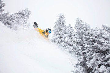 Freeride snowboarder on ski slope