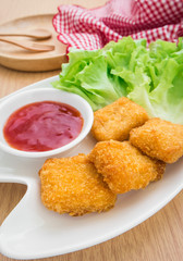 Chicken nuggets with ketchup on plate