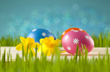 Colored Easter eggs on blue sky background