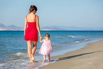 Mother and daughter on the beach