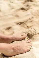 sandy feet on the beach