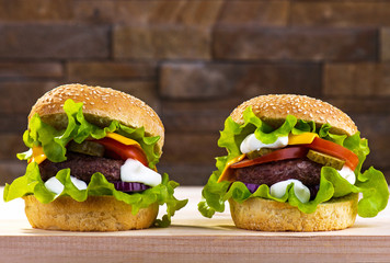 Big burger with beef cutlet and fresh vegetables