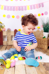 Fototapeta premium beautiful boy with Easter eggs