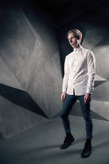 Obraz premium Stylish man looking away in white shirt, fashion male Full Lengt