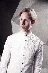 Stylish man looking away in white shirt