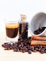 A Coffee cup and coffee beans on  wooden panel - With copy space