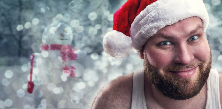 Smiling man in Santa Claus hat