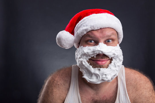 Smiling man in Santa Claus hat