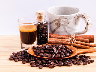 A Coffee cup and coffee beans on  wooden panel - With copy space