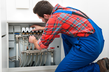 Technician servicing the underfloor heating