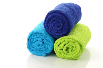 colorful rolled up and stacked bathroom towels
