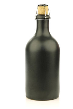 grey ceramic beer bottle with a cork