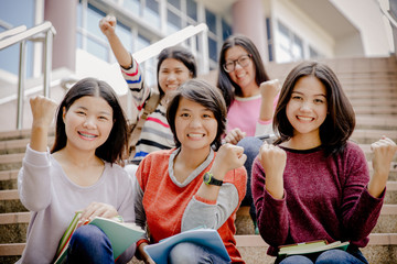 group of happy teen high school students outdoors