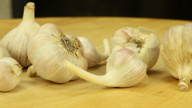 Garlic on a wooden boards background