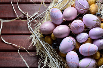 Easter eggs in a white wire basket