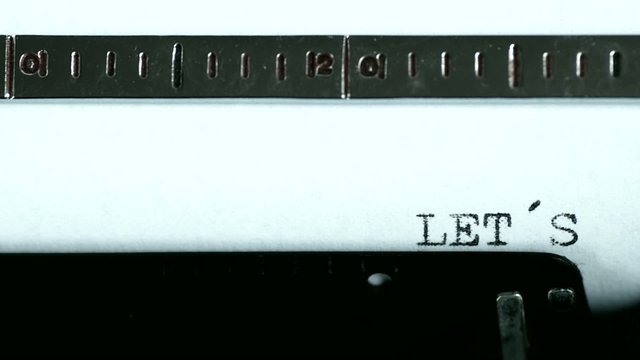 Typewriter. Typing text: let&acute;s play
