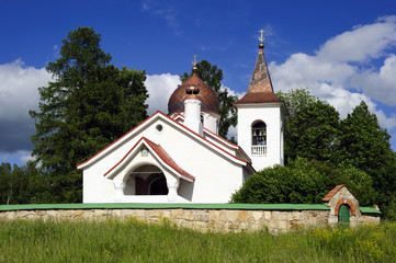 Fototapeta na wymiar Small white christian church in summer day in Polenovo