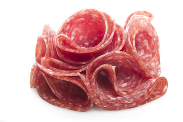 Salami sliced and bread with lattuce on white