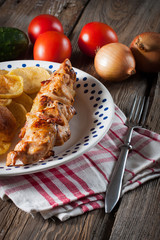 Shashlik with fried potatoes.