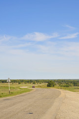 Vertical photo of a coutryside road
