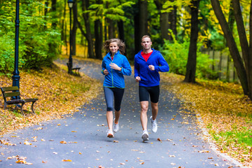 Healthy lifestyle - woman and man running