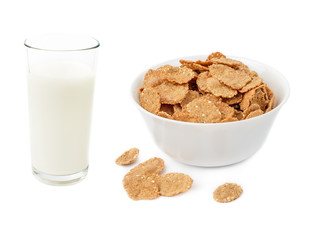 Cornflake cereals in bowl and glass of milk