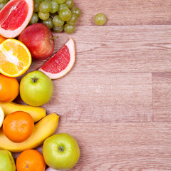 Fruits and vegetables on a wooden background