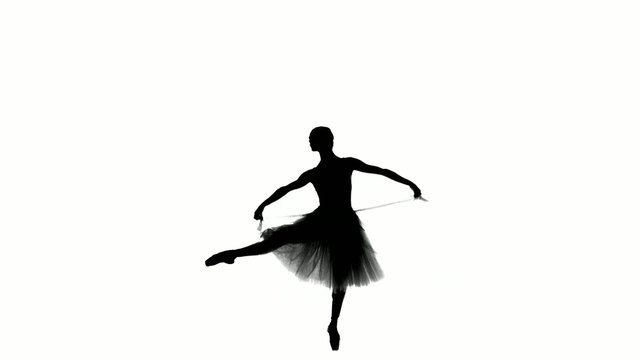 Attractive ballerina making dance trick known as glissade, on