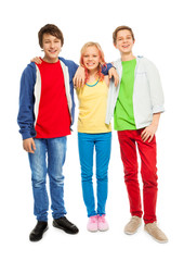 Three cute teens stand with hands on shoulders