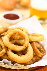 Homemade beer-battered onion rings in a basket