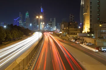 Gordijnen Traffic in the city of Kuwait at night, Middle East © philipus
