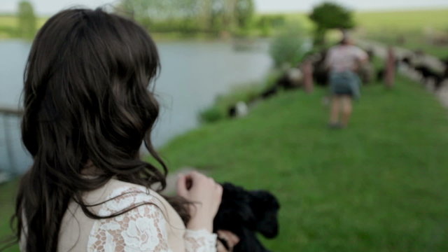 Girl with a lamb in her arms
