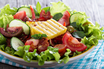 Salad with fresh vegetables, grilled polenta