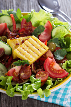 Salad with fresh vegetables, grilled polenta
